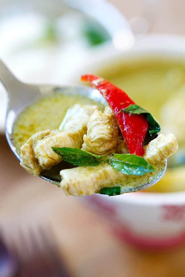 Authentic Thai green curry recipe and green curry soup on a spoon.
