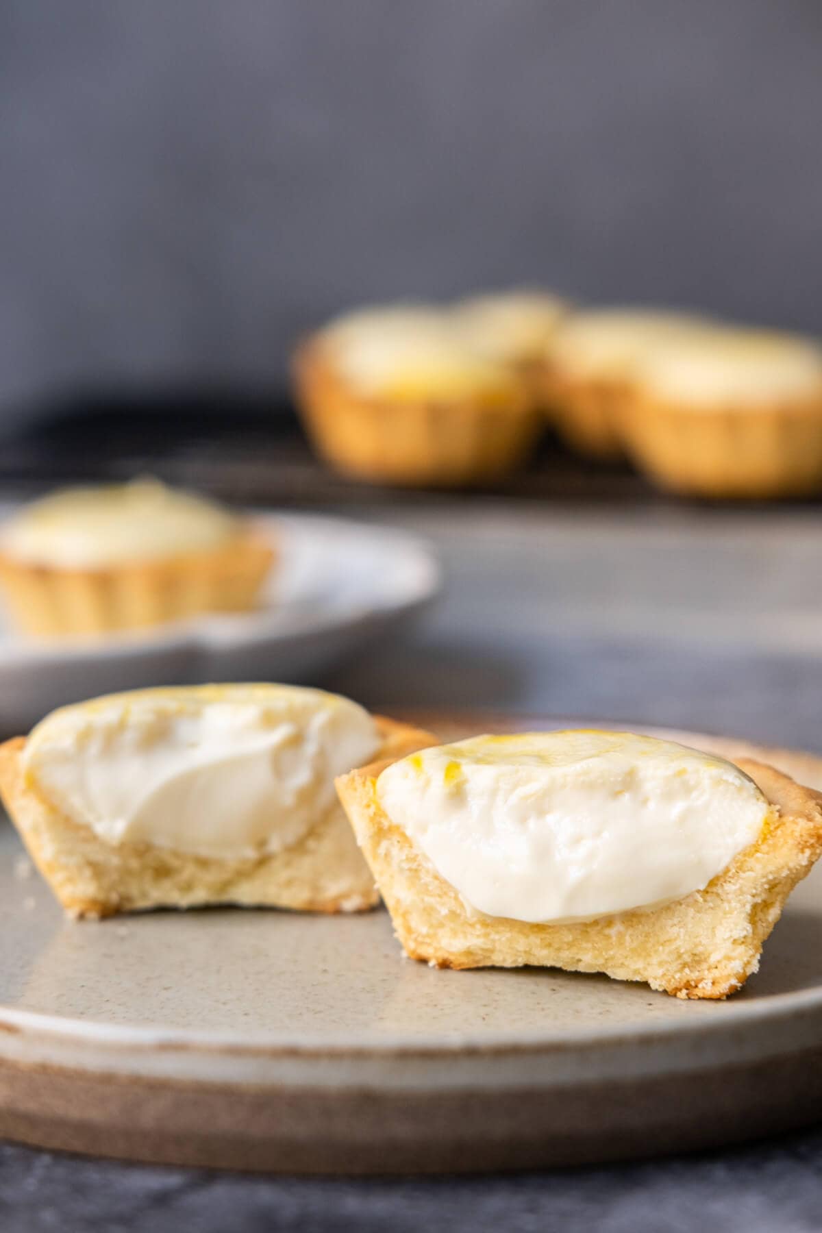 Hokkaido cheese tarts cut open half, featuring a beautifully golden-brown crust and a rich cheese filling.