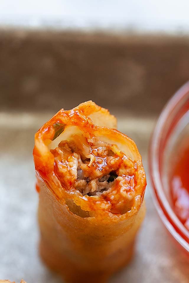 Lumpia filled with lumpia filling, and dipped into sweet and sour lumpia sauce.