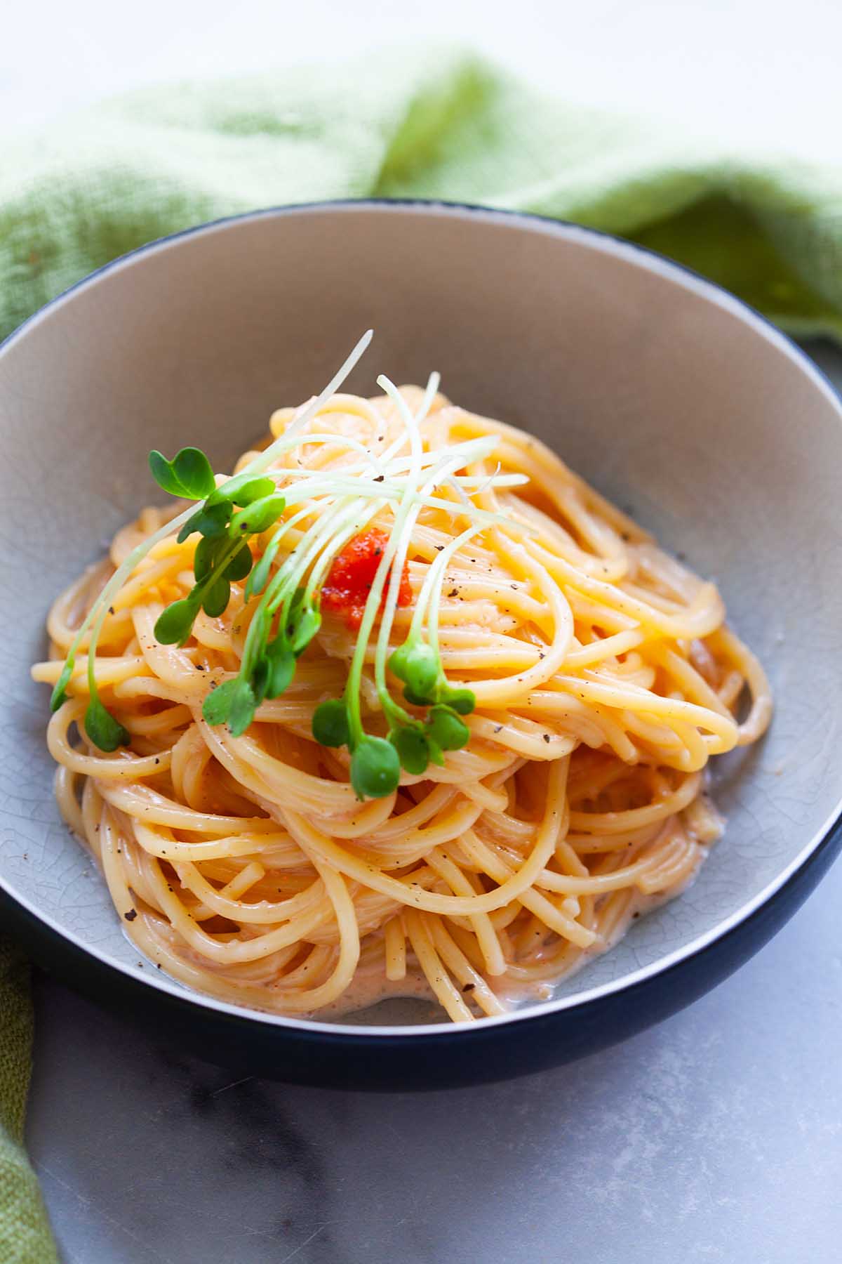 Mentaiko spaghetti dish presented in a visually appealing manner, featuring vibrant colors and enticing flavors.