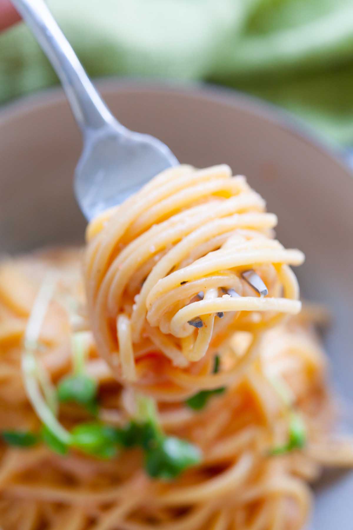 Mentaiko pasta swirled around a fork presented in an appetizing way, highlighting the savory and rich flavors of this Japanese-inspired delight.