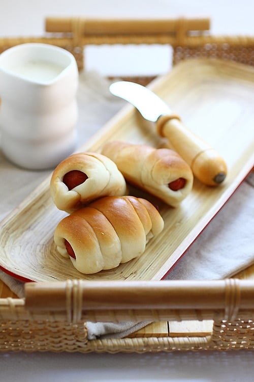 Pigs in a blanket on a serving tray.
