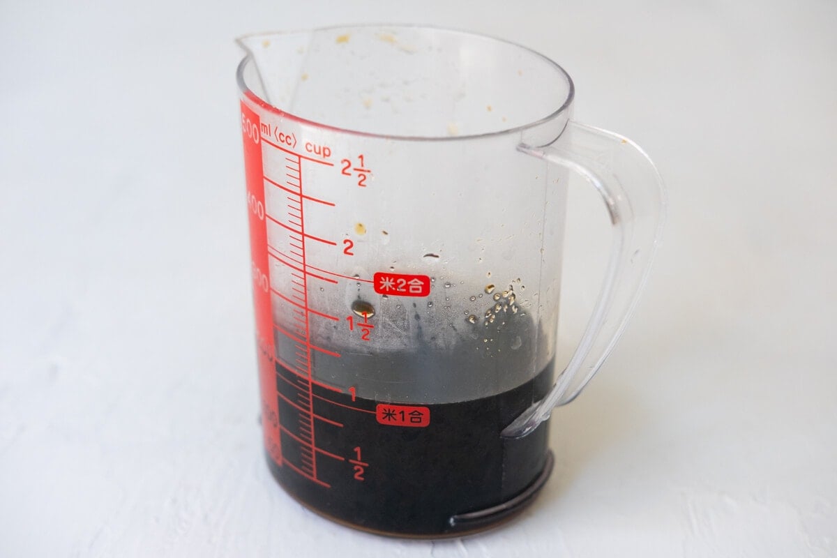 Homemade teriyaki sauce in a measuring cup. 