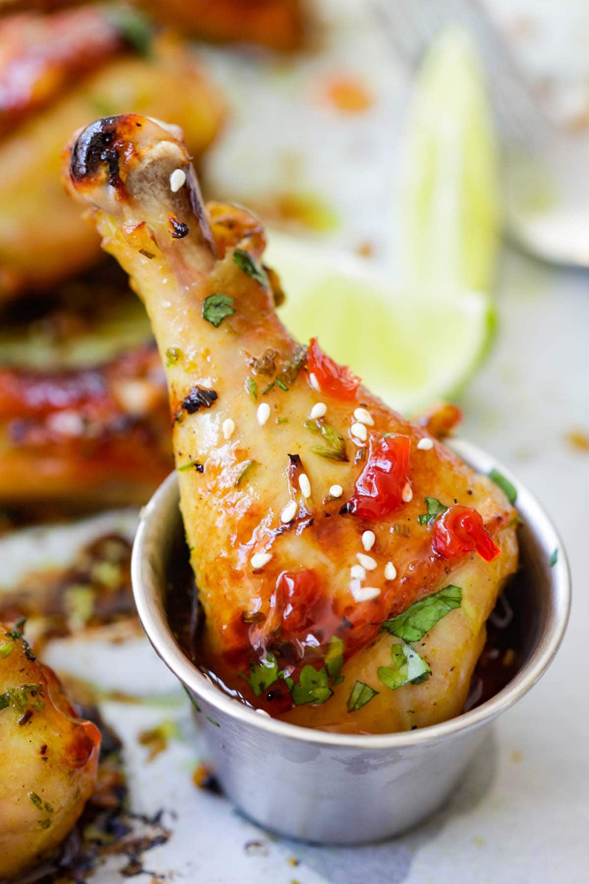 A chicken drumsticks dipped in Thai sweet chili sauce.